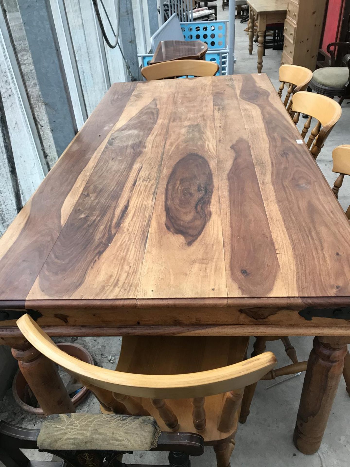 AN INDONESIAN WOOD DINING TABLE AND FIVE BEECH DINING CHAIRS