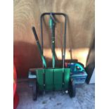 A BOSCH AHS 4-16 HEDGE CUTTER, A GARDEN FERTILISER SPREADER AND A PAIR OF SHEARS IN WORKING ORDER