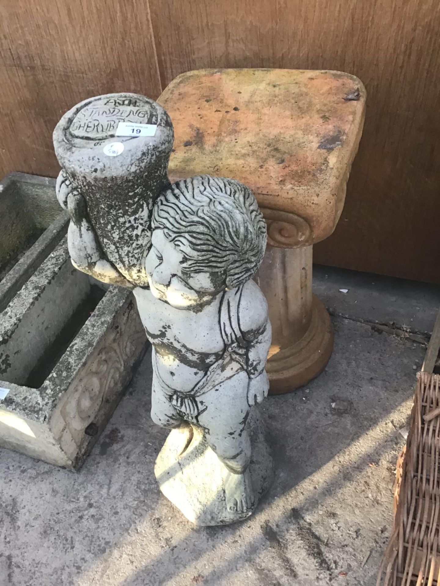 TWO GARDEN ORNAMENTS TO INCLUDE A PLANT STAND AND A STANDING CHERUB