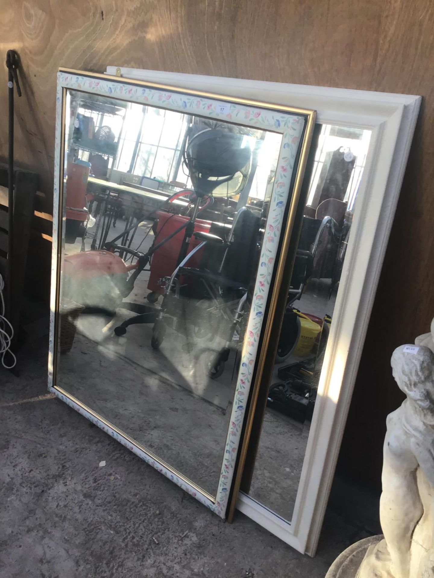 TWO LARGE MIRRORS ONE WITH A WHITE FRAME ONE WITH A FLORAL FRAME