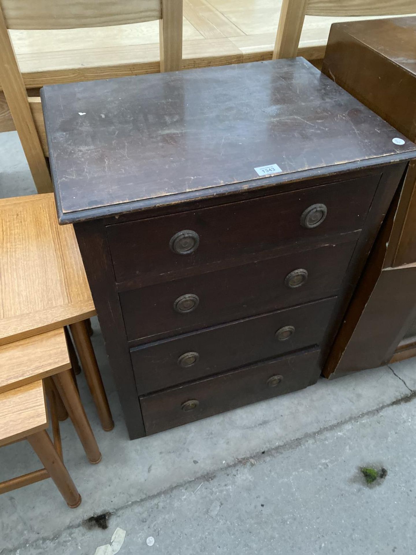 AN OAK CHEST OF FOUR DRAWERS