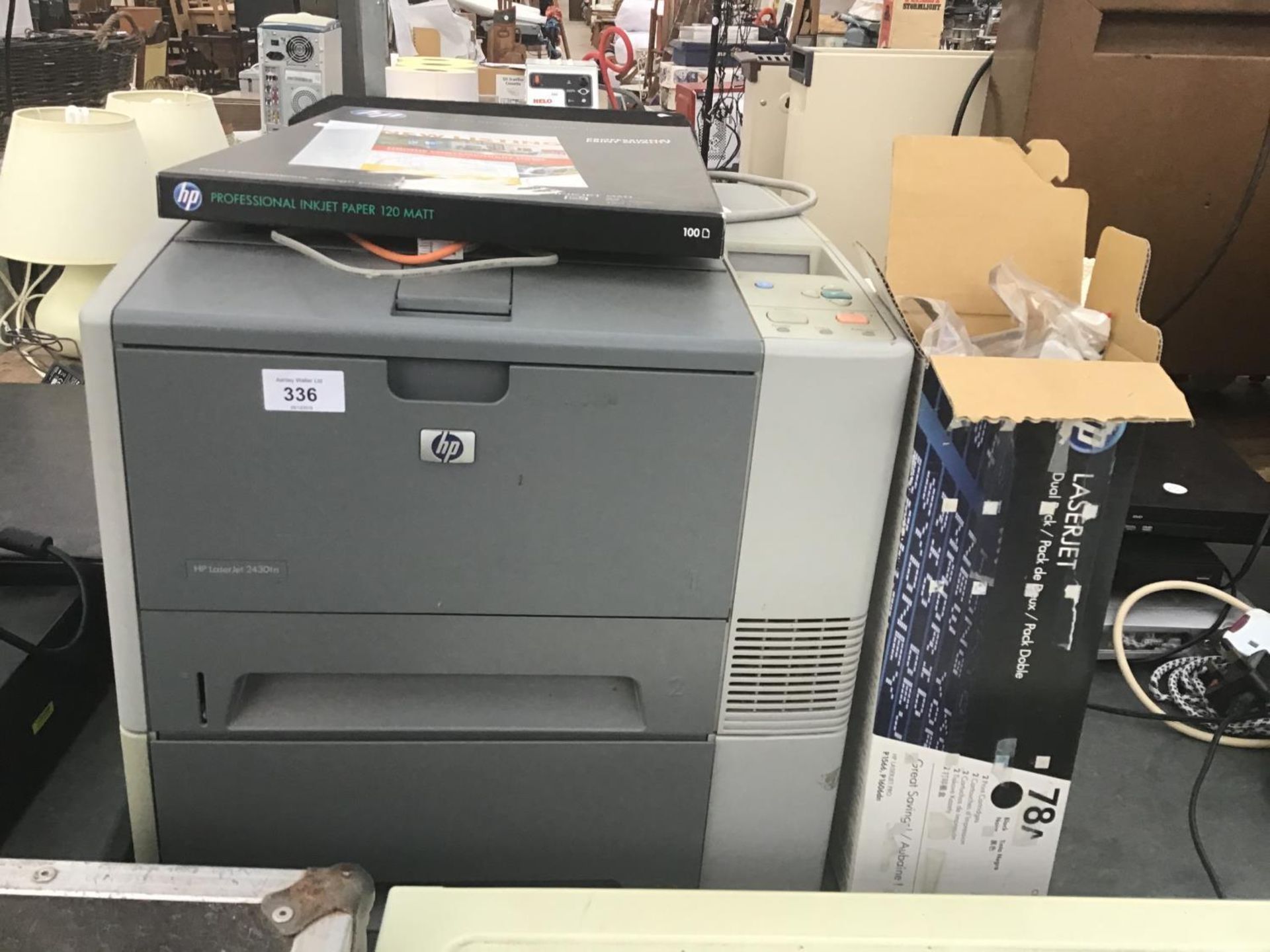 A HP LASER JET 2430 PRINTER WITH PAPER AND INK IN WORKING ORDER