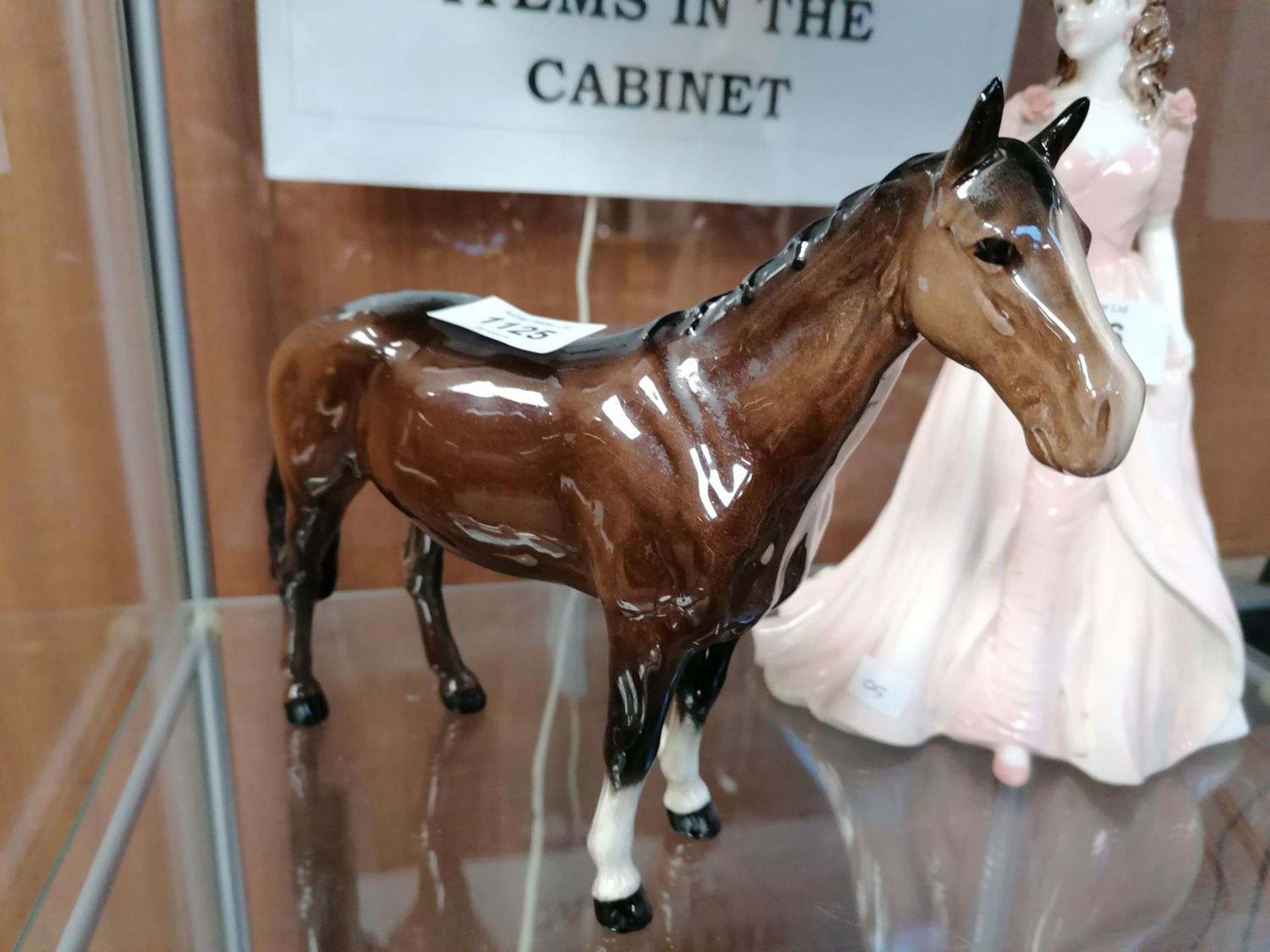 A BESWICK BROWN GLOSS CERAMIC HORSE MODEL