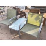 TWO GARDEN CHAIRS AND A GLASS TOPPED TABLE