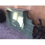 A GREEN PAINTED WOODEN ORNATE OVER MANTLE