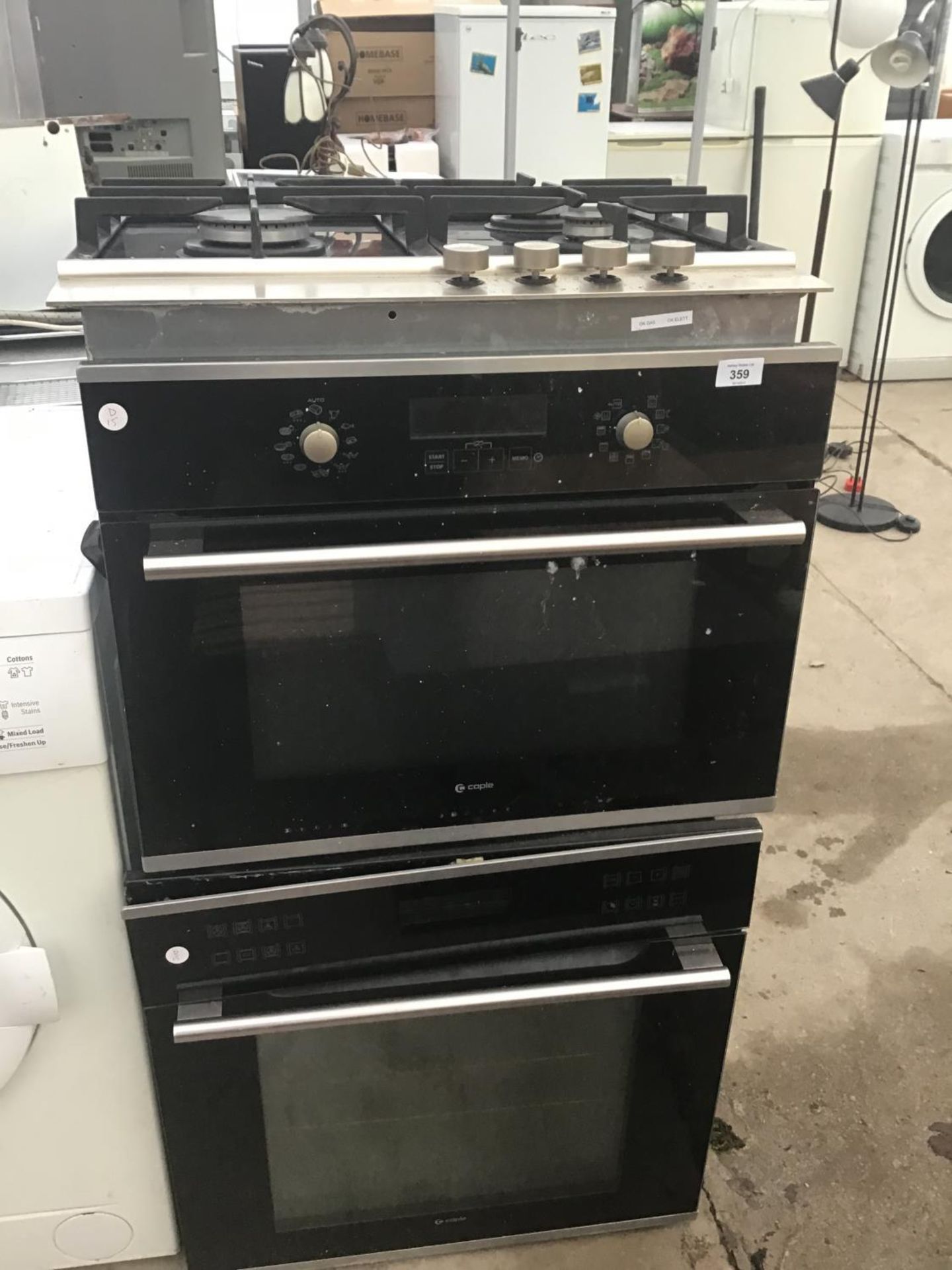 A GAS HOB WITH INTEGRATED MICROWAVE/OVEN AND LOWER OVEN (DIRECT WIRED BUT WORKING WHEN REMOVED)