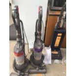 TWO DYSON HOOVERS RED DC25 (BRUSH NOT WORKING) AND A PURPLE DC25