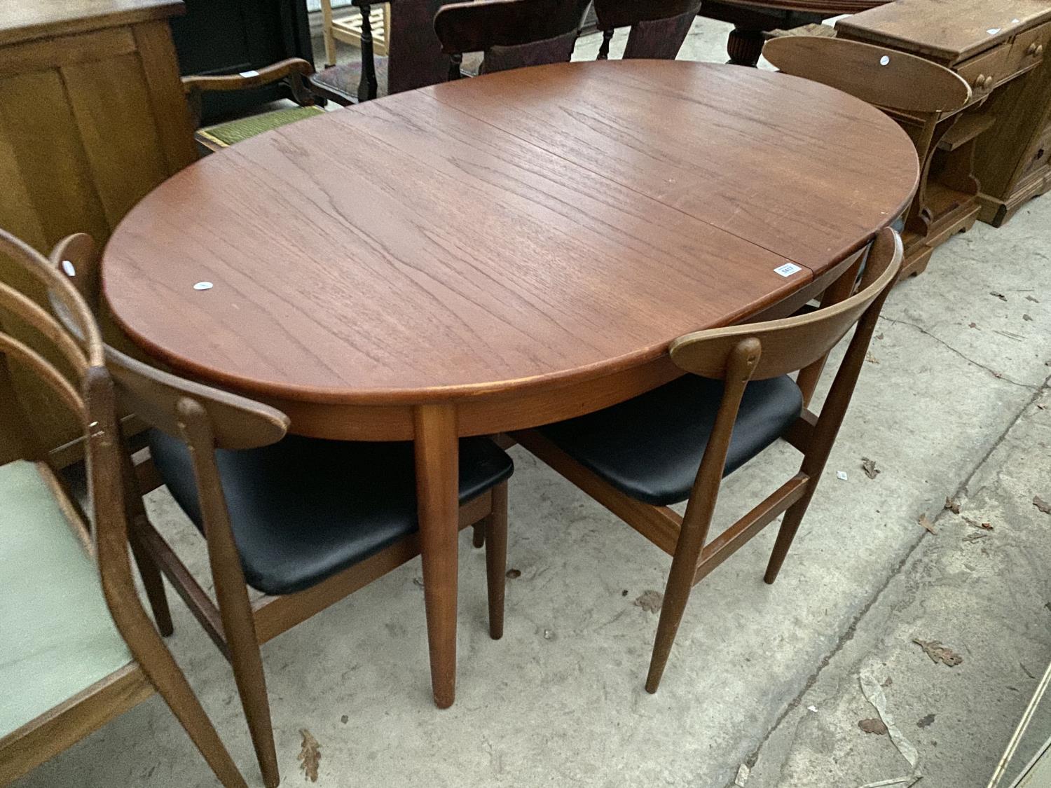 A TEAK EXTENDING DINING TABLE WITH THREE CHAIRS