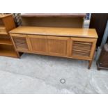 A RETRO TEAK SIDEBOARD WITH TWO FALL FRONT DOORS AND TWO LOUVRE DOORS