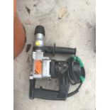 A HEAVY DUTY ELECTRIC SDS DRILL IN WORKING ORDER