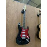 A BLACK AND RED STRAT ELECTRIC GUITAR