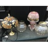 TWO ORNATE TABLE LAMPS AND TWO GLASS SHADES IN WORKING ORDER