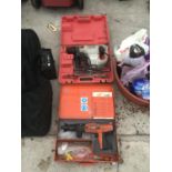 A CASED SPLT 200 NAIL GUN AND A CASED DUOTOOL SDS HAMMER DRILL