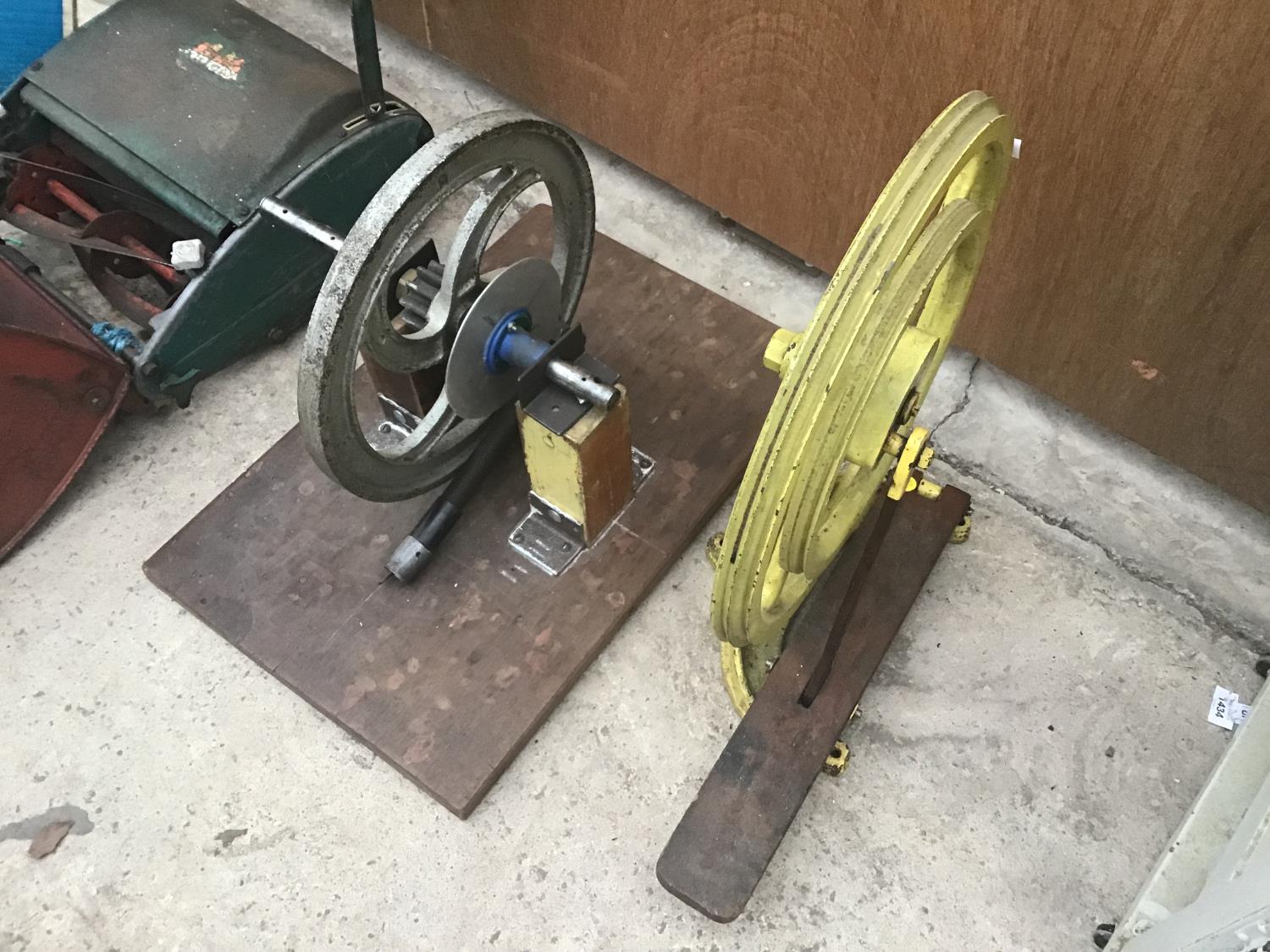 TWO VINTAGE PULLEYS