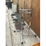 A CHROME CLOTHES RAIL, A DOLLY POSSER, FIRE FRONT