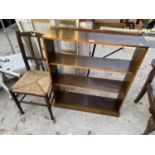 AN OAK THREE TIER BOOKCASE AND AN OAK DINING CHAIR WITH RUSH SEAT