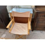 A BEECH DIRECTOR'S CHAIR AND A SMALL KITCHEN CABINET WITH FORMICA TOP