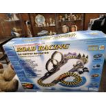 A BOXED ROAD RACING AC SUPPLY OPERATED TURBO TEC SCALEXTRIC STYLE RACING GAME WITH CARS