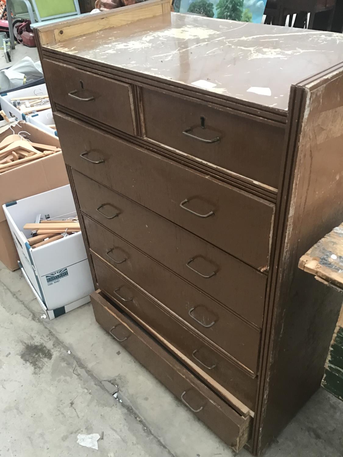 A VINTAGE CHEST OF TWO SHORT AND FIVE LONG DRAWERS