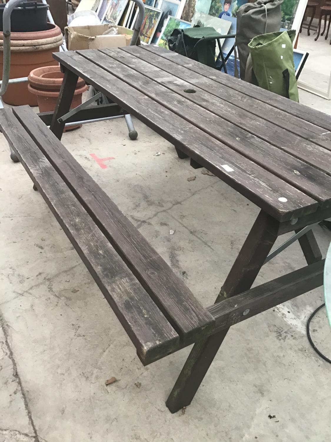 A WOODEN PICNIC BENCH