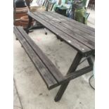 A WOODEN PICNIC BENCH