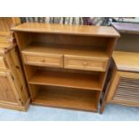 A TEAK THREE TIER BOOKCASE WITH TWO DRAWERS