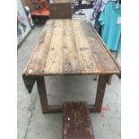 A VINTAGE PLANK TOPPED TABLE/WORKBENCH 175CM X 75CM (CORNER CUT OUT SEE PHOTO)