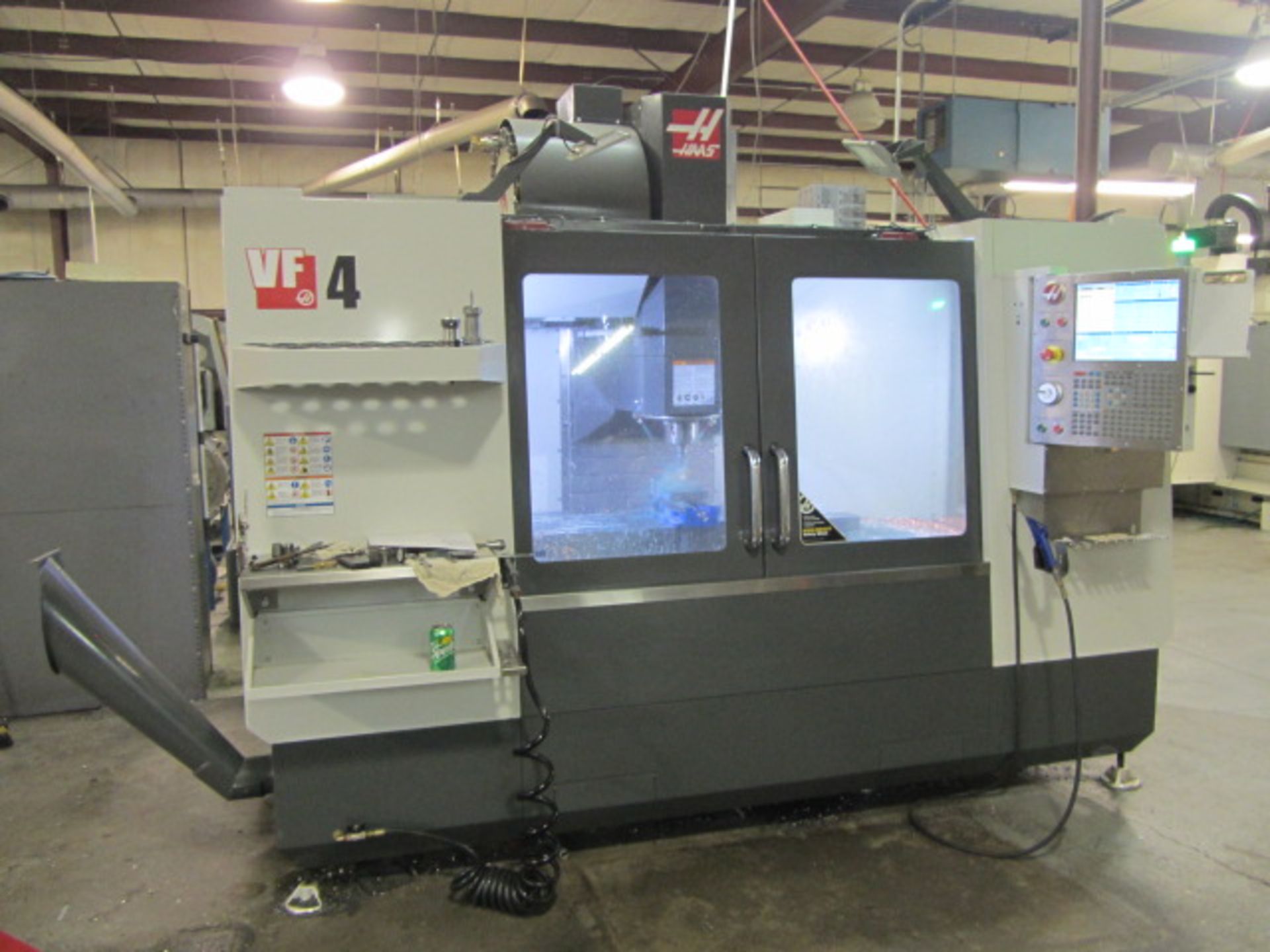 Haas VF-4 CNC Vertical Machining Center with 52'' x 20'' Table, #40 Taper Spindle Speeds to 8100