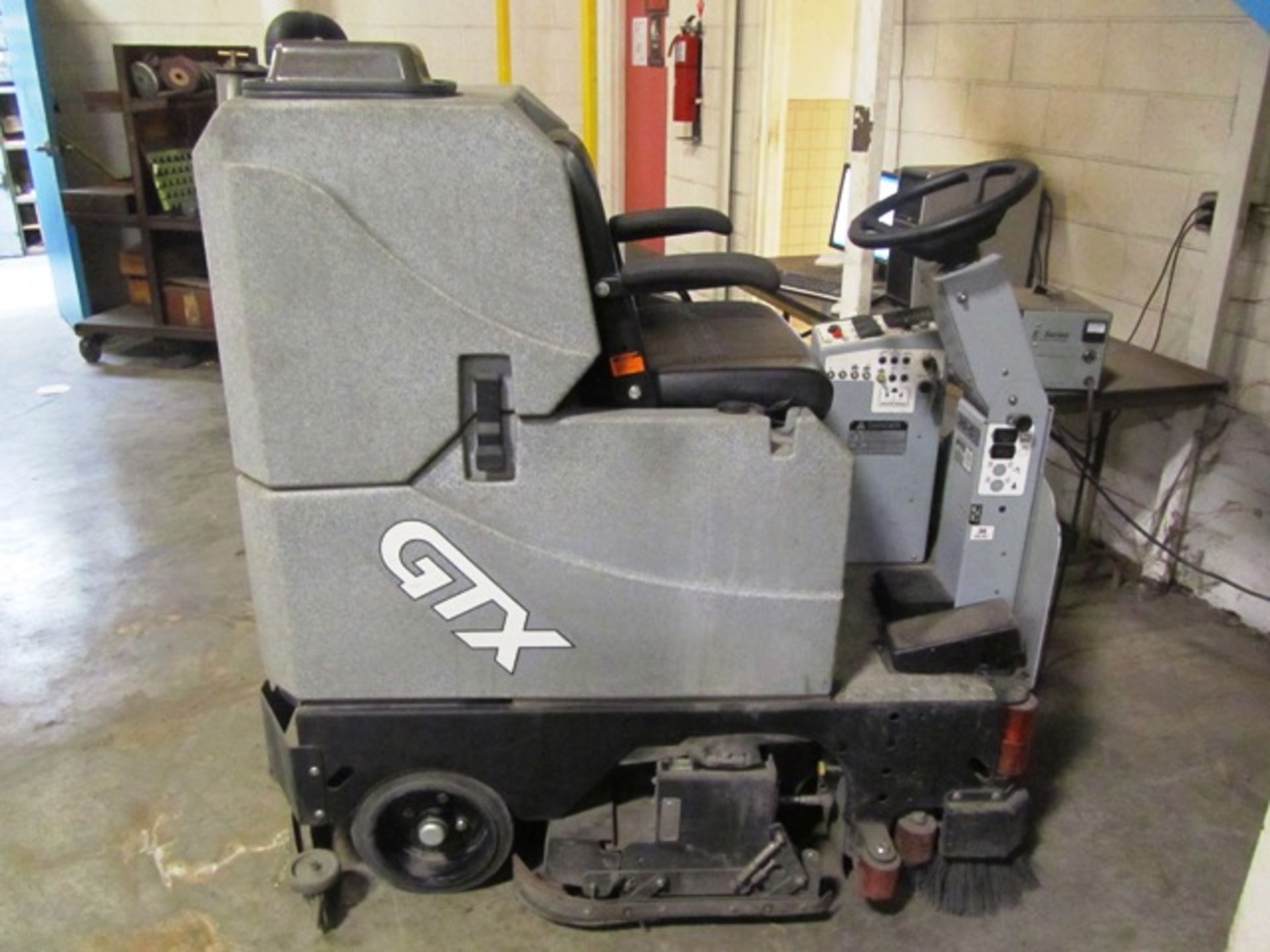 GTX Sit Down Type Floor Scrubber with Charger, sn:84080 (may need new battery)