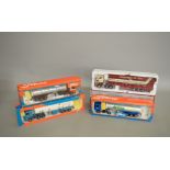 Three boxed Tekno 1:50 scale diecast model trucks including two Scania tractor units and a Volvo,