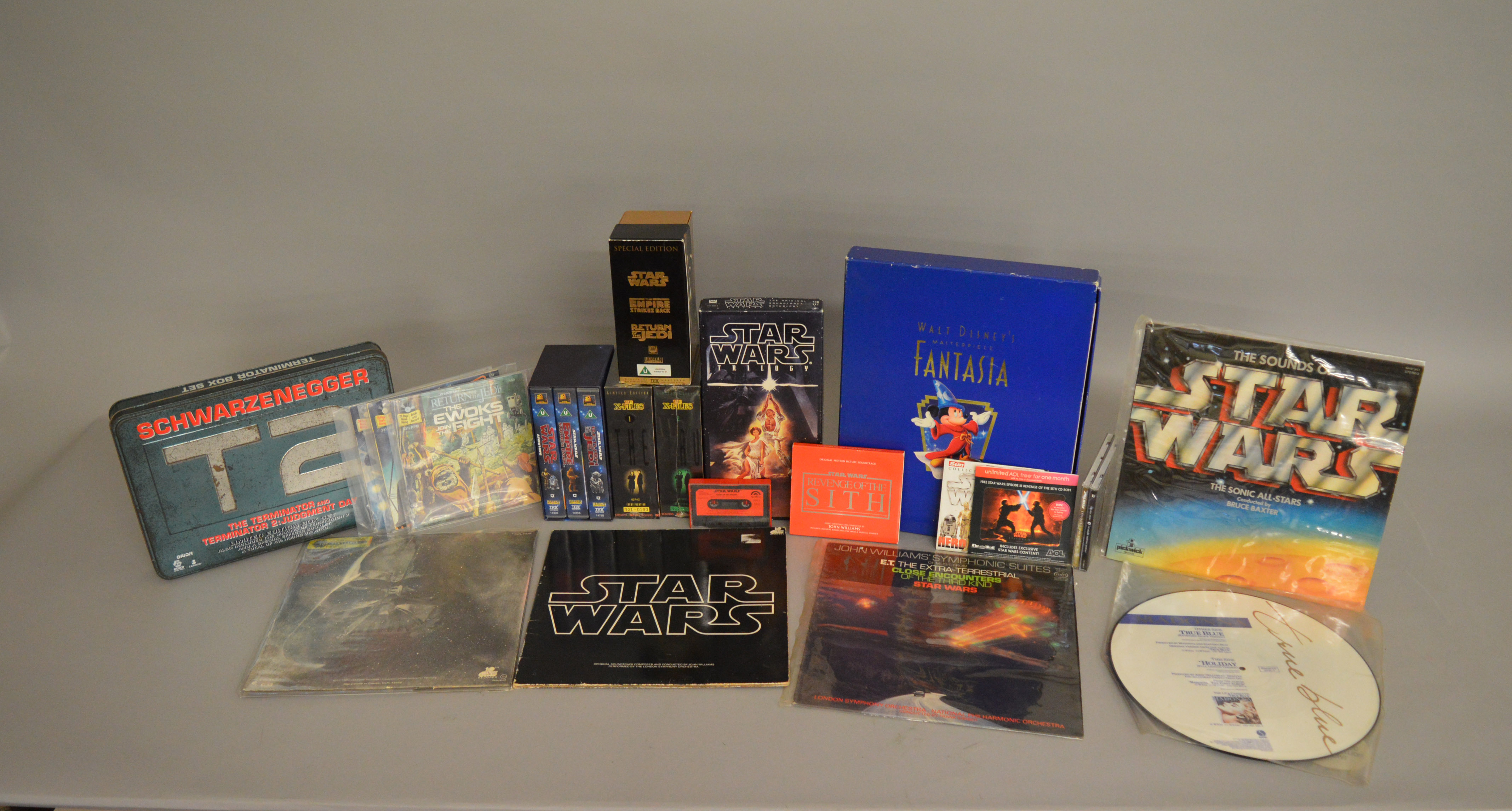 A collections of LPs, Videos etc including; Star Wars The Empire Strikes Back record with book,