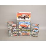 Twelve Revell plastic model kits, all 1:24 scale vehicles including Audi and VW Samba bus.