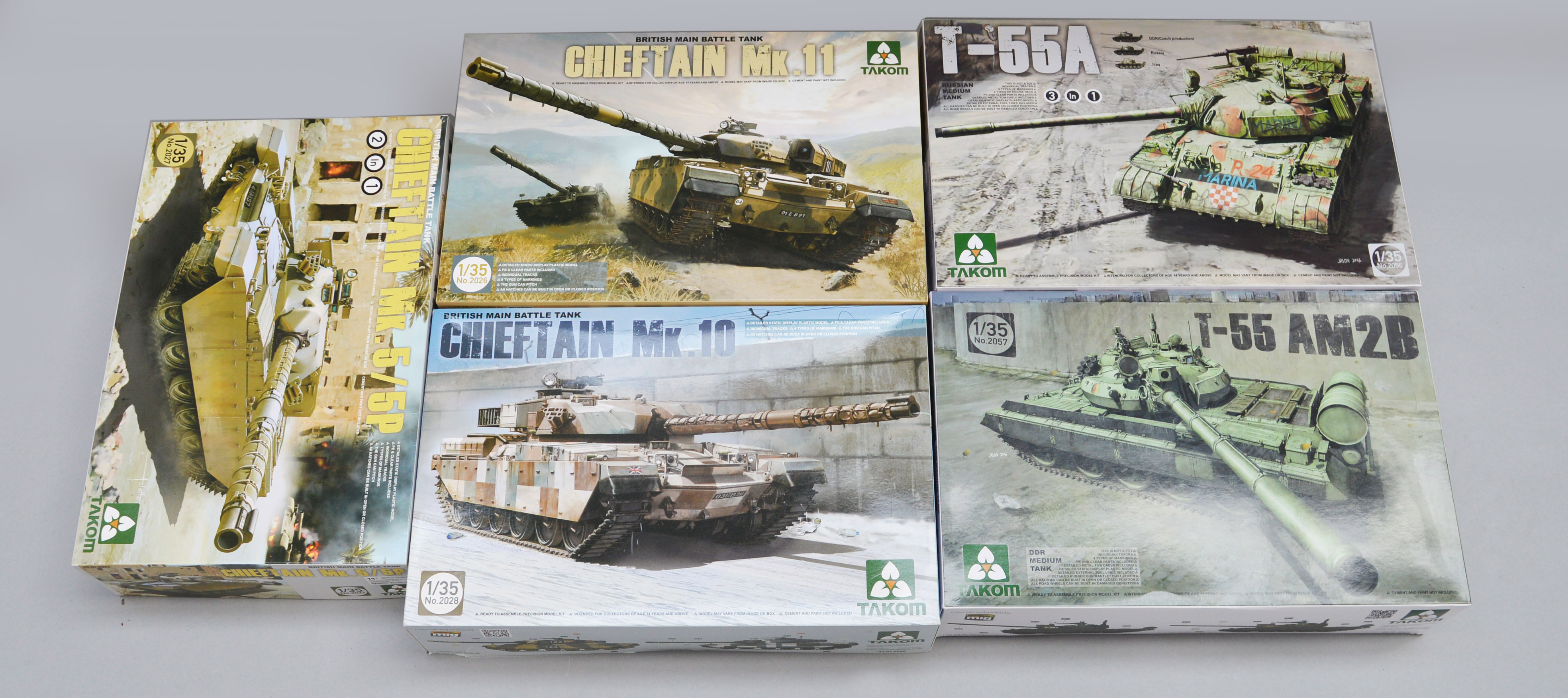 Five Takom 1:35 scale plastic model kits: three Chieftain tanks; two T-55 tanks. E, unused.