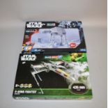 Two Revell Star Wars plastic model kits: 96715 AT-AT; 06690 X-wing Fighter. Boxed, ex-shop stock.