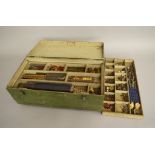 A good quantity and variety of used loose Meccano parts housed in a vintage three tier