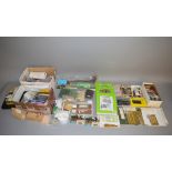 A quantity of railway related kits including cardboard buildings,
