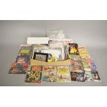 A good selection of mainly Star Wars items including comics, posters,