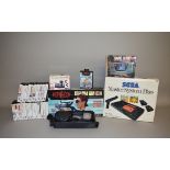 A selection of vintage Gaming Equipment including a boxed Sega Master System Plus Video Games