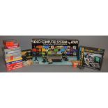 Video computer system by Atari plus paddle controllers, and games which includes; Q*bert Smurfs,