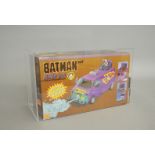 A boxed 1990 Toy Biz Batman Movie Series Joker Van, AFA Graded 75 Ex+/NM in perspex case.