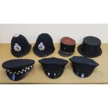 Police helmets - two of American style with peak caps (size 7 3/8"),