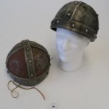 Two Robin Hood movie prop helmets (Errol Flynn era) worn and showing signed of rust with metal