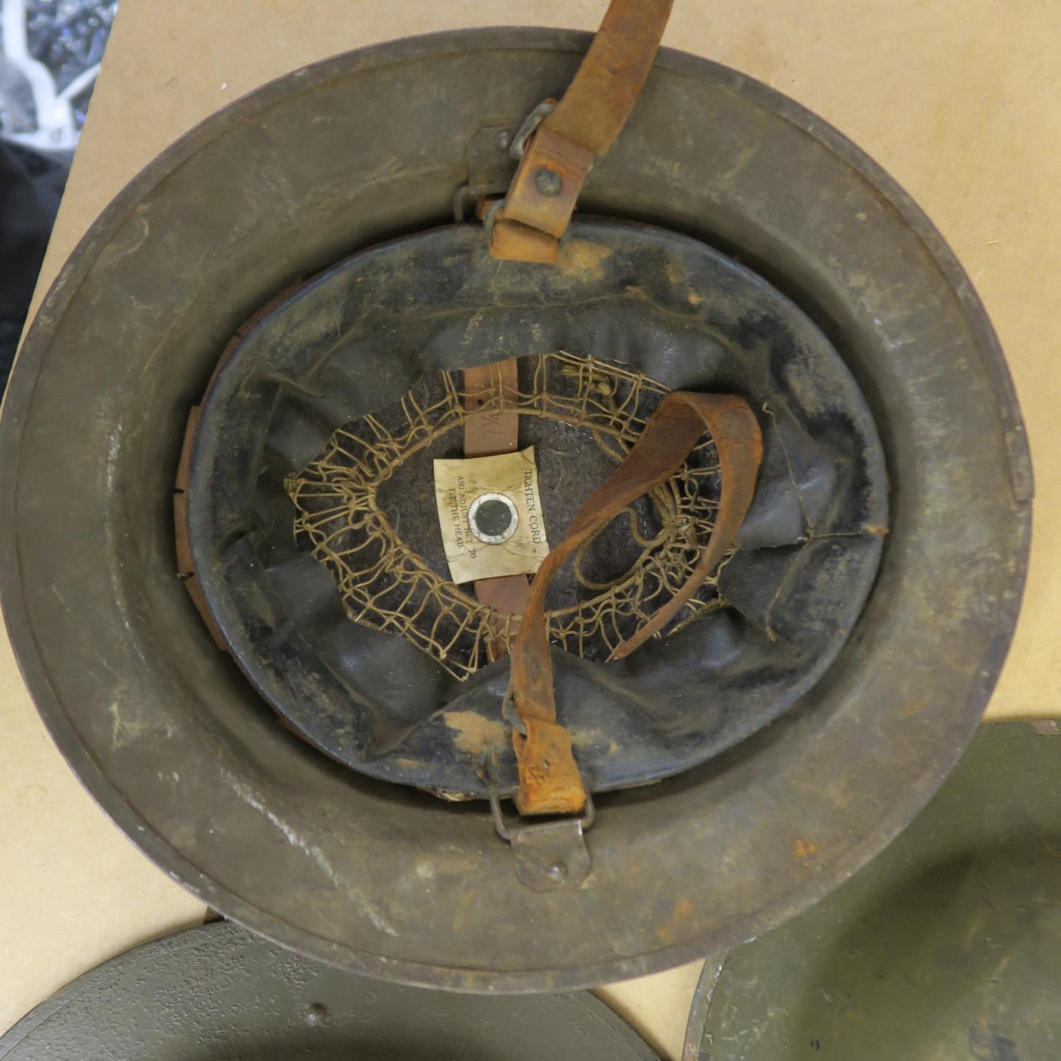 A collection of metal helmets with five being of a military style, - Image 3 of 7