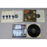 Three Beatles LP vinyl records including A Hard Days Night Mono yellow and black Parlophone label