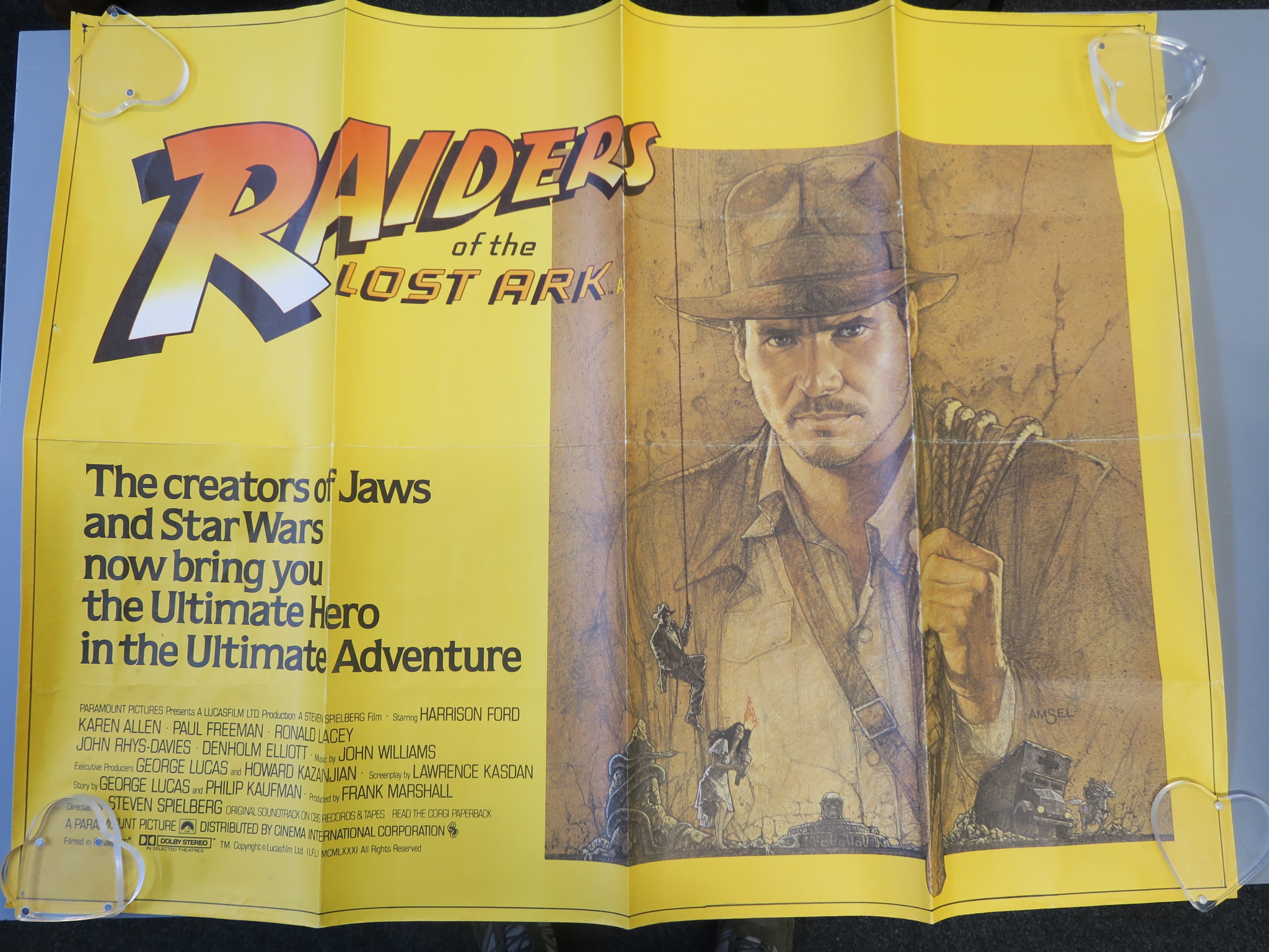 Raiders of the Lost Ark British Quad film poster stars Harrison Ford as Indiana Jones in folded