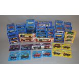 A good quantity of boxed and carded miniature diecast car, van and truck models,