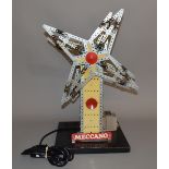 EX-SHOP STOCK: A Meccano windmill set on a wooden base and powered by an electric motor with lights.