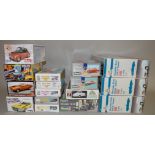 EX-SHOP STOCK: Sixteen boxed model car kits by Revell, Italeri,