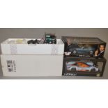 Two boxed diecast model cars in 1:18 scale,