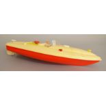 An unboxed plastic clockwork Speedboat, approximately 50cm long,